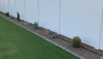 White wooden privacy fence installation by Chop Chop Landscaping in Mesa, AZ residential yard
